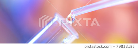 Chemical test tube and pipette with a drop of liquid in a chemical laboratory. A baby is reflected in a drop of liquid. Fertilization concept Chemical test tube and pipette with a drop of liquid in a chemical laboratory. A baby is reflected in a drop of liquid. Fertilization concept 79838185