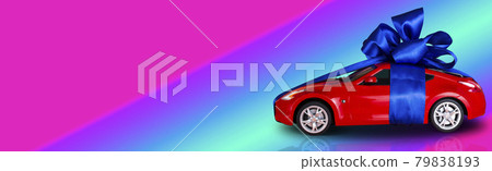 Red car with a blue bow as a gift on a neon background with a place for text 79838193