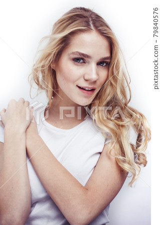 young pretty stylish blond hipster girl posing emotional isolated on white background happy smiling cool smile, lifestyle people concept young pretty stylish blond hipster girl posing emotional isolated on white background happy smiling cool smile, lifestyle people concept 79840576