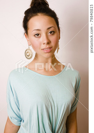 young brunette woman dressed like ancient greek godess, gold jewelry close up isolated young brunette woman dressed like ancient greek godess, gold jewelry close up isolated 79840815