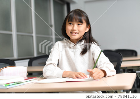 Image of elementary school girls studying during class Image of elementary school girls studying during class 79841116