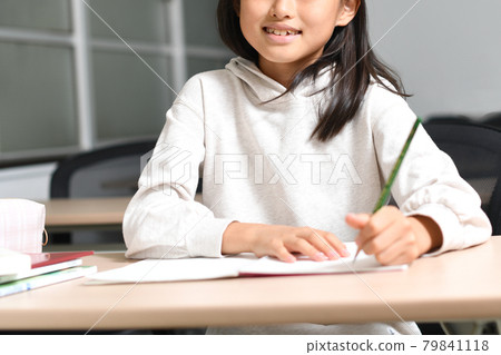 Image of elementary school girls studying during class Image of elementary school girls studying during class 79841118