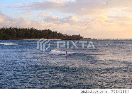 People surfing in the Hawaiian ocean 79841584