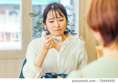 A woman with a loss of appetite, likes and dislikes, and a bad expression A woman with a loss of appetite, likes and dislikes, and a bad expression 79844095