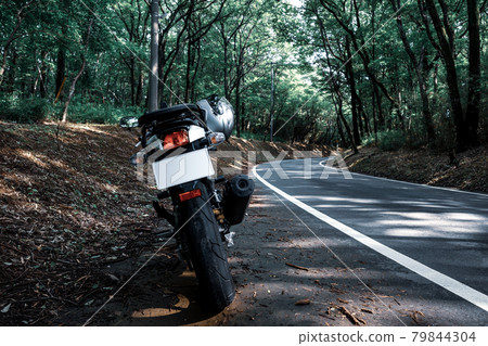 Summer bike touring Curve of sunlight through the forest a-2 Cool light color Summer bike touring Curve of sunlight through the forest a-2 Cool light color 79844304