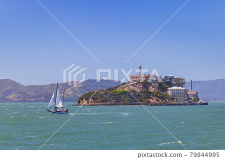 Sunny view of the Alcatraz Island and San Francisco Bay with a boat Sunny view of the Alcatraz Island and San Francisco Bay with a boat 79844995