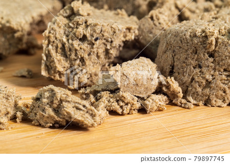 Sunflower halva close-up macro selective focus. Pieces of halva. Oriental sweets Sunflower halva close-up macro selective focus. Pieces of halva. Oriental sweets 79897745