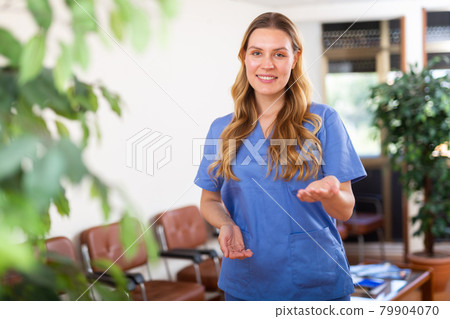 Female doctor assistant standing in medical office 79904070