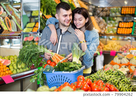 Man and woman are deciding on vegetables Man and woman are deciding on vegetables 79904262