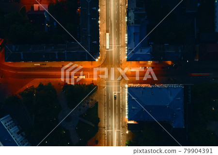 Crosroad in the city with blurred cars Crosroad in the city with blurred cars 79904391