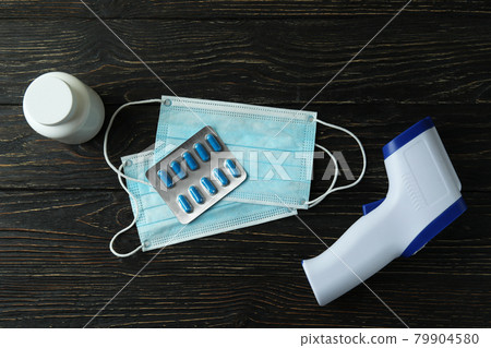 Medical tools and thermometer gun on wooden background 79904580