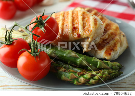 Concept of tasty eating with grilled chicken, close up Concept of tasty eating with grilled chicken, close up 79904632
