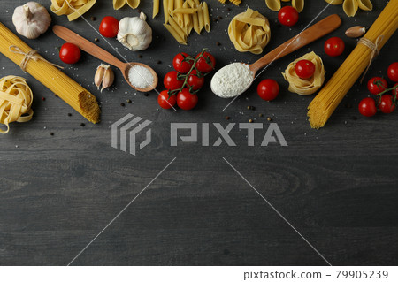 Concept of cooking tasty pasta on dark wooden background Concept of cooking tasty pasta on dark wooden background 79905239