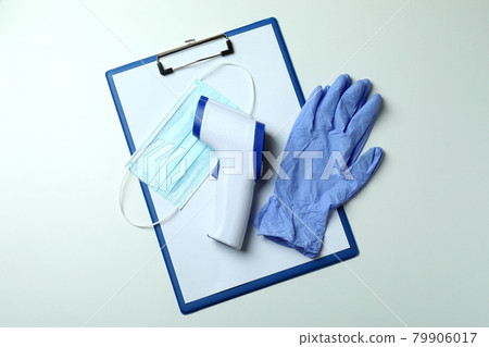 Medical tools and thermometer gun on white background Medical tools and thermometer gun on white background 79906017