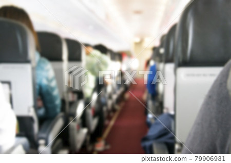 Interior of airplane with blurred photo of passenger on seats Interior of airplane with blurred photo of passenger on seats 79906981