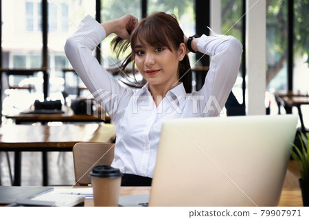 Cheerful young asian student female in living room. online learning, studying , online shopping, freelance, asean concept. 79907971