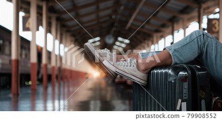 Alone traveler tourist walking with luggage at train station. work and travel lifestyle concept. 79908552