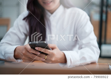 A businesswoman completes KYC using an online banking program in order to open a digital savings account. The definition of cyber security. 79908922