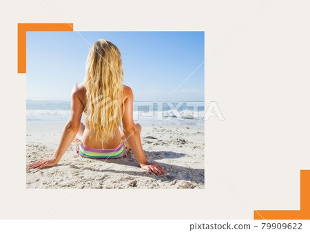 Photograph of rear woman sunbathing at the beach against grey background Photograph of rear woman sunbathing at the beach against grey background 79909622