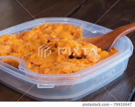 Raw sea urchin from high-class seafood in a plastic container. Raw sea urchin from high-class seafood in a plastic container. 79910047