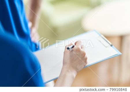 View materials with binder Caregiver's hand 79910848