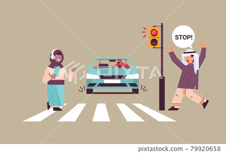 schoolgirl with smartphone and headphones crossing road on red traffic lights arabic driver stops car immediately road safety schoolgirl with smartphone and headphones crossing road on red traffic lights arabic driver stops car immediately road safety 79920658