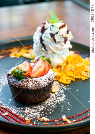 chocolate cake lava with strawberry and vanilla ice-cream chocolate cake lava with strawberry and vanilla ice-cream 79924078