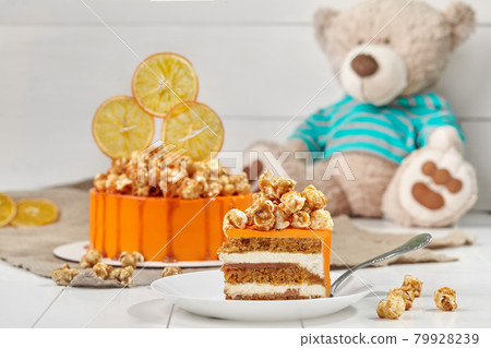 Carrot-orange sponge cake with mascarpone cream and salted caramel Carrot-orange sponge cake with mascarpone cream and salted caramel 79928239