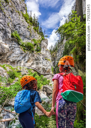 Taxenbach Kitzlochklamm, children watching a deep gorge with beautiful nature scenery near Zell am See, Salzburgerland, Austria Taxenbach Kitzlochklamm, children watching a deep gorge with beautiful nature scenery near Zell am See, Salzburgerland, Austria 79928845