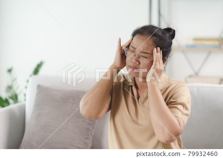 Exhausted tired depressed stressed thoughtful mature senior woman suffering from headaches, Brain diseases, mental problems, Alzheimer Concept. Exhausted tired depressed stressed thoughtful mature senior woman suffering from headaches, Brain diseases, mental problems, Alzheimer Concept. 79932460