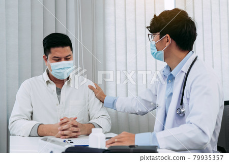 Doctor took comfort in the patient's arm to explain the disease. Doctor took comfort in the patient's arm to explain the disease. 79935357