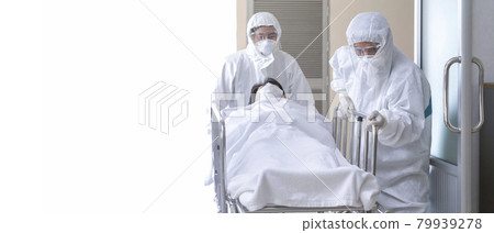 asian male nurse and doctor wearing ppe suit and face mask pushing stretcher gurney bed with seriously infected coronavirus or covid-19 patient towards quarantine room in hospital with copy space. asian male nurse and doctor wearing ppe suit and face mask pushing stretcher gurney bed with seriously infected coronavirus or covid-19 patient towards quarantine room in hospital with copy space. 79939278