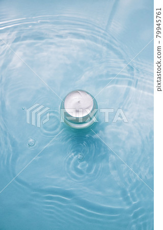 Natural Cosmetic product on water with splashes Jar with cream on aqua background 79945761