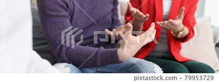 Young couple communicating with psychologist in office closeup Young couple communicating with psychologist in office closeup 79953729