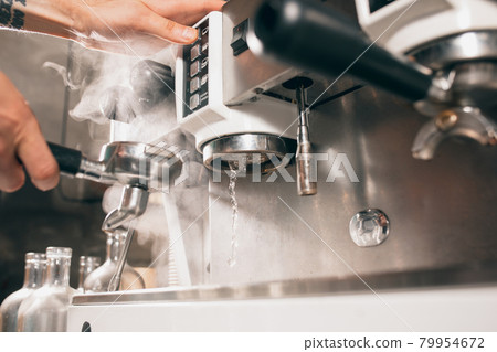Close up image. Maintenance, cleaning of coffee machine. Making hot aromatic coffee. 79954672