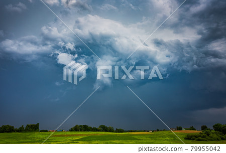 Extreme thunderstorm supercell with white hail core, hail falling on a village Extreme thunderstorm supercell with white hail core, hail falling on a village 79955042