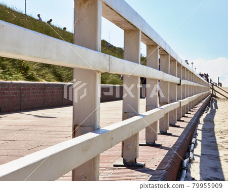 White wooden balustrade on the beach promenade of Westerland, Sylt, Germany White wooden balustrade on the beach promenade of Westerland, Sylt, Germany 79955909