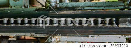 Abstract, detailed view of the conveyor chain for tools on an old machine 79955930