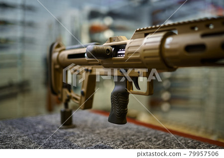 Powerful rifle on counter in gun store closeup Powerful rifle on counter in gun store closeup 79957506