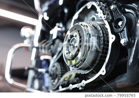Sports motorcycle engine in service center closeup 79958765