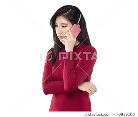 woman pick up a cell phone with an anxious expression. 79959100