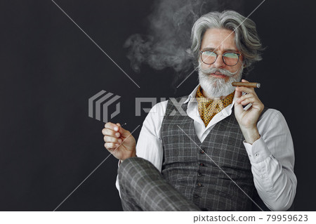 Handsome pensive mature businessman in formal suit 79959623