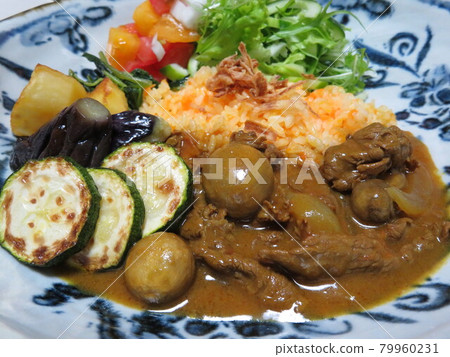 Beef curry with carrot rice and lots of vegetables 79960231