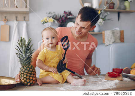 Beautiful family prepare food in a kitchen 79960538