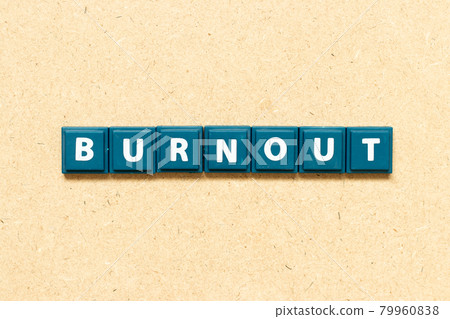 Tile alphabet letter in word bunout on wood background 79960838