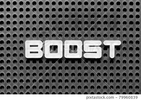 White alphabet letter in word boost on black pegboard background 79960839