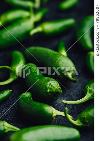 Green Jalapeno Peppers on Concrete Background Green Jalapeno Peppers on Concrete Background 79962687