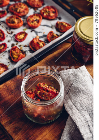 Freshly Cooked Sun Dried Tomatoes with Thyme in a Glass Jar Freshly Cooked Sun Dried Tomatoes with Thyme in a Glass Jar 79962688