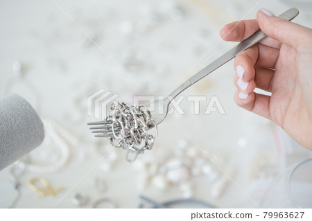 Professional jewelry designer making handmade jewelry in studio workshop. Fashion, creativity and handmade concept Professional jewelry designer making handmade jewelry in studio workshop. Fashion, creativity and handmade concept 79963627