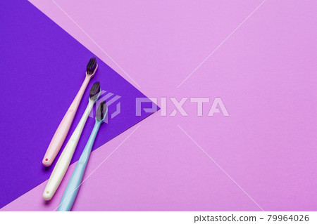 Flat lay composition with manual toothbrushes on color background, close up 79964026